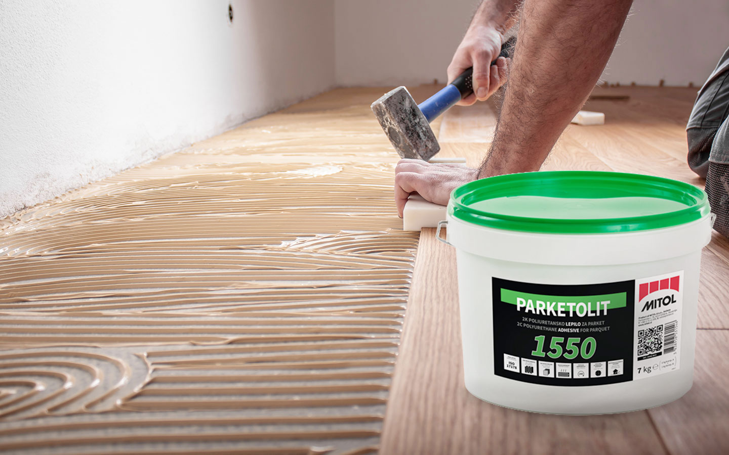 Applying flooring adhesive for parquet installation